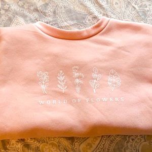 Pink “world of flowers” sweatshirt